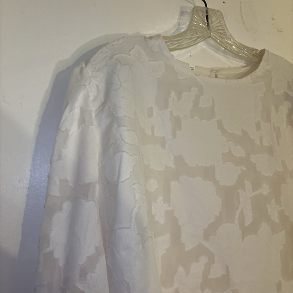 Zulily top in XXL has embossed flowers It’s  lining the sleeve are see-threw - Picture 6 of 15